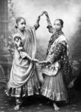 The word Nautch is an anglicized version of nāc, a word found in Hindi and Urdu and several other languages of North India, derived from the Sanskrit, Nritya, via the Prakrit, Nachcha. A simple and literal translation of Nautch is 'dance' or 'dancing'.<br/><br/>

The culture of the performing art of Nautch rose to prominence during the later period of Mughal Empire, and the East India Company Rule. Over a period of time, the Nautch traveled outside the confines of the Imperial courts of the Mughals, the palaces of the Nawabs and the Princely states, and the higher echelons of the officials of the British Raj, to the places of smaller Zamindars, and other places.<br/><br/>

Some references use the terms Nautch and Nautch girls to describe Devadasis who used to perform Hindu ritual and religious dances in the Hindu temples of India. However, there is not much commonality between the Devadasis and the Nautch girls. The former performed dances in the precincts of the Hindu temples to please the temple deities, whereas  Nautch girls performed for the pleasure of men.